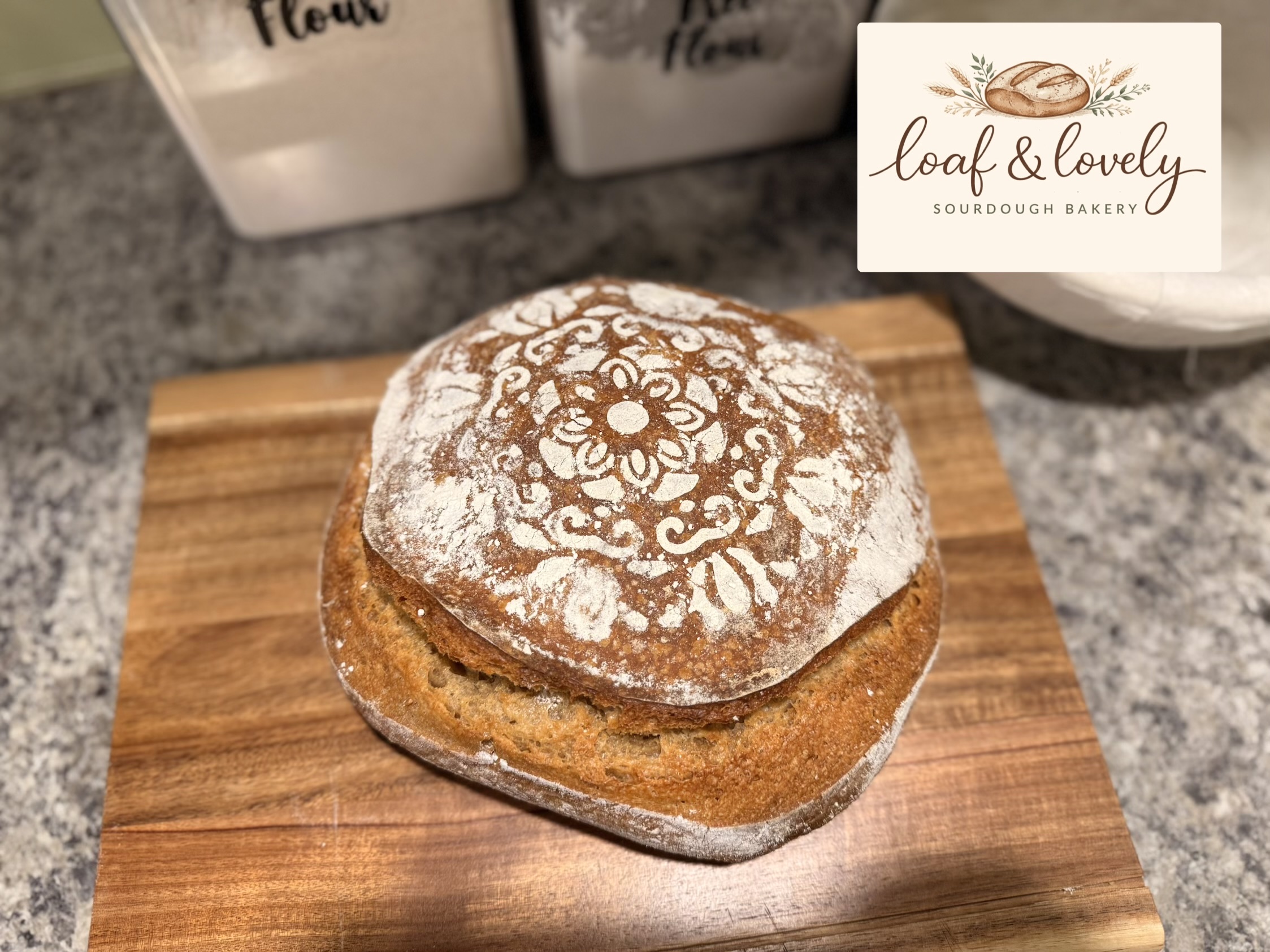 Beautifully scored and stenciled sourdough boule from Loaf and Lovely
